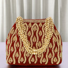 Maroon potli bag named Embroidered Beaded Potli Purse, featuring faux pearl detailing and soft fabric texture | Peora
