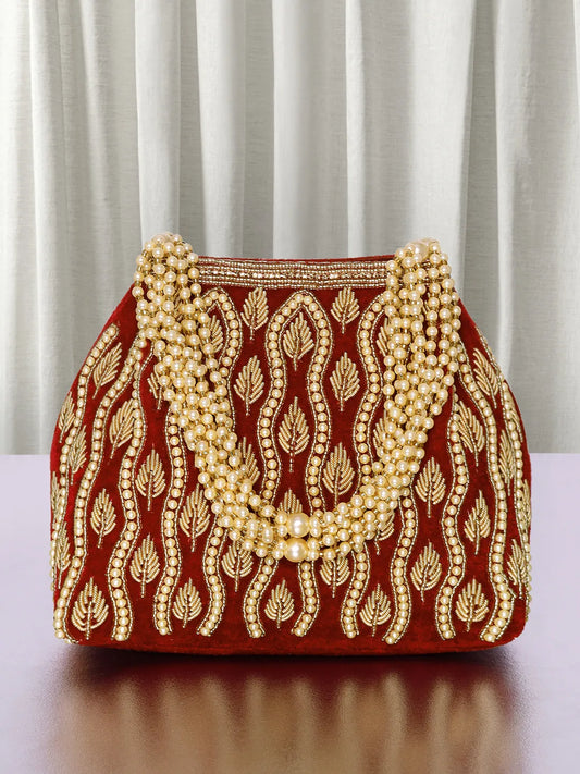 Maroon potli bag named Embroidered Beaded Potli Purse, featuring faux pearl detailing and soft fabric texture | Peora
