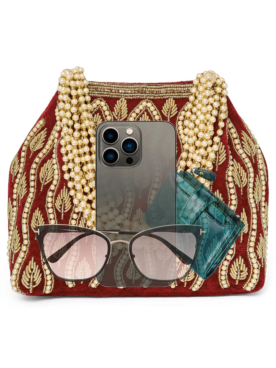 Maroon potli bag named Embroidered Beaded Potli Purse, featuring faux pearl detailing and soft fabric texture | Peora
