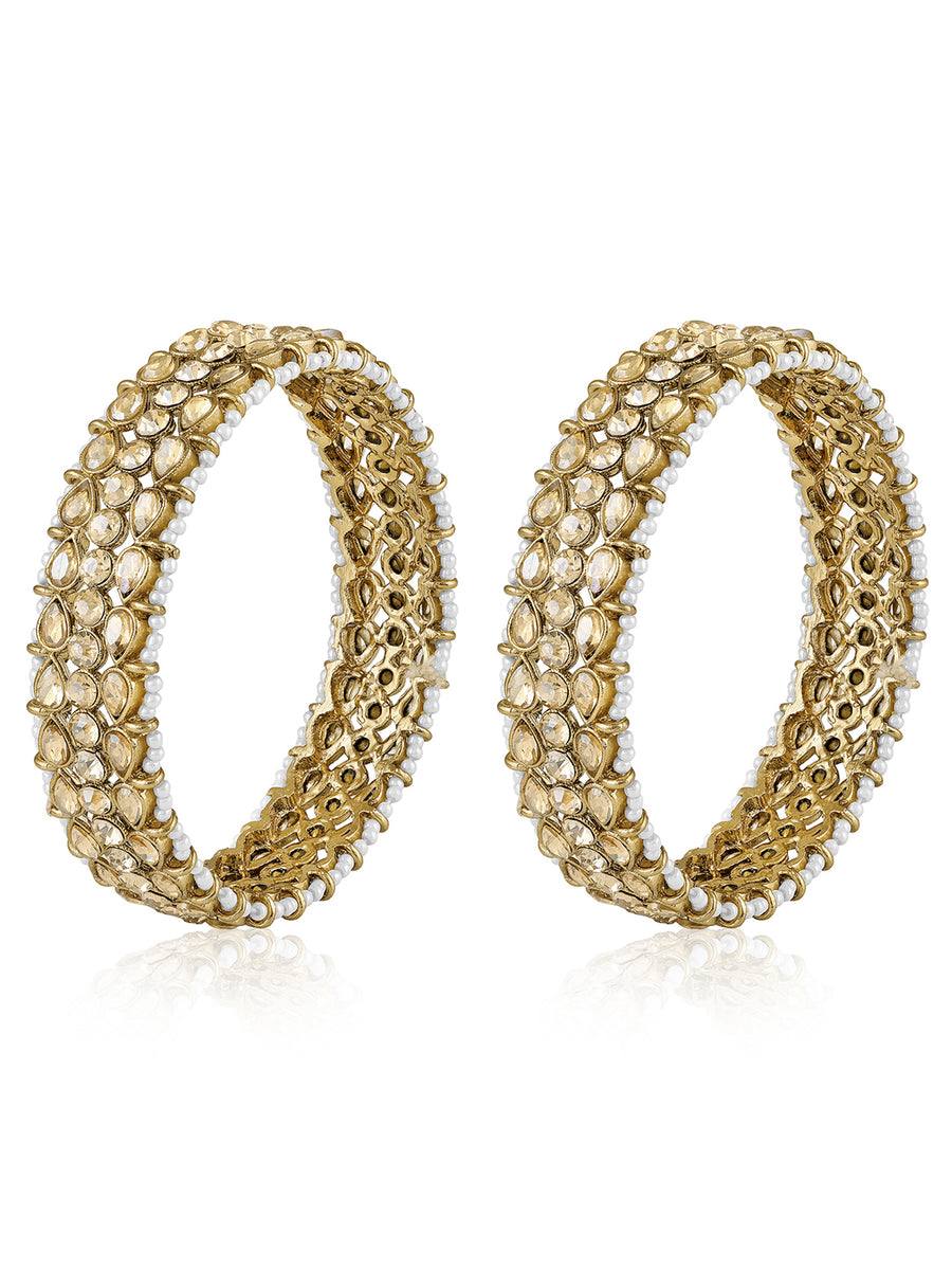 Festive Finish Faux Kundan Pair. Pair of Bangles with Champagne colour kundan stones along with pearls on the edge.