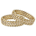 Festive Finish Faux Kundan Pair. Pair of Bangles with Champagne colour kundan stones along with pearls on the edge.