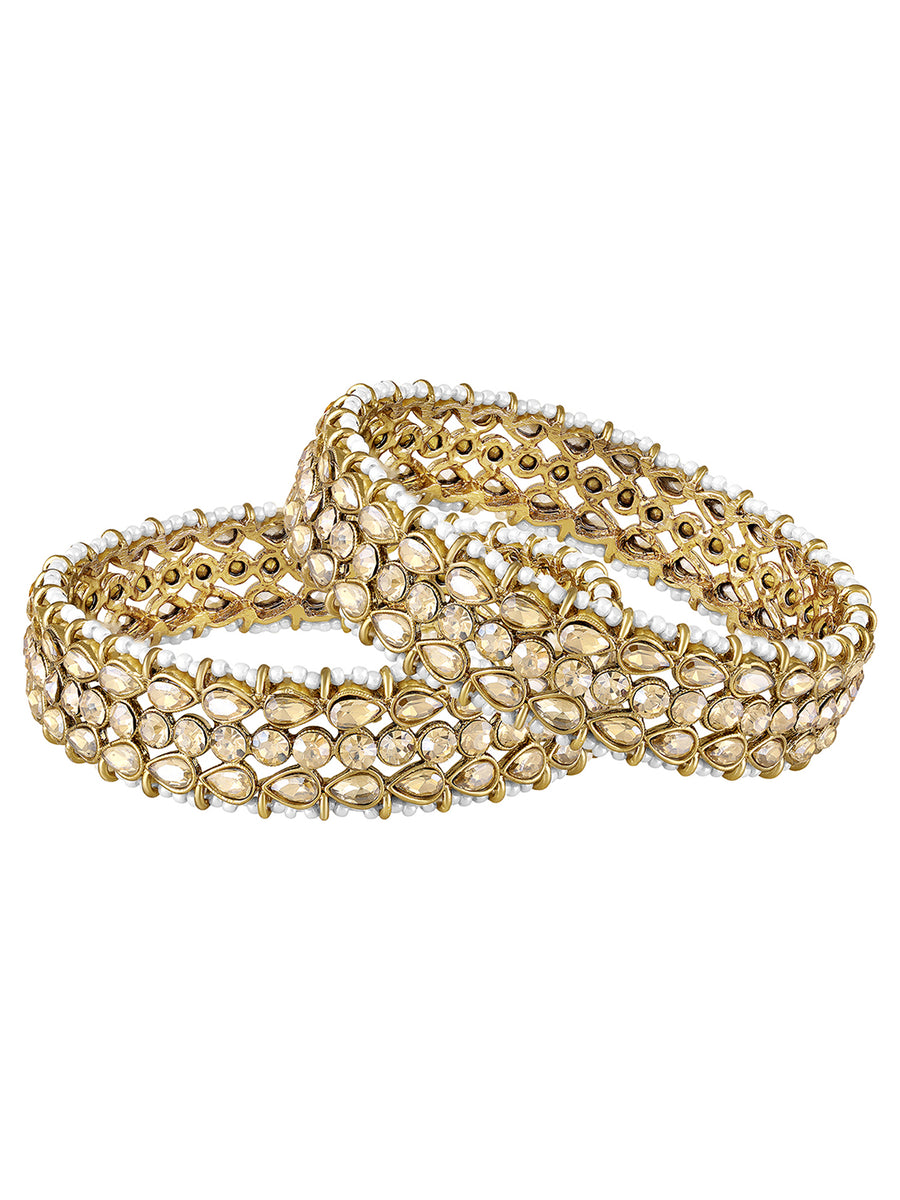 Festive Finish Faux Kundan Pair. Pair of Bangles with Champagne colour kundan stones along with pearls on the edge.
