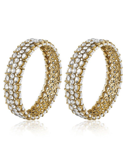 Festive Finish Faux Kundan Pair. Pair of Bangles with white colour kundan stones along with pearls on the edge.