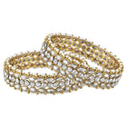 Festive Finish Faux Kundan Pair. Pair of Bangles with white colour kundan stones along with pearls on the edge.