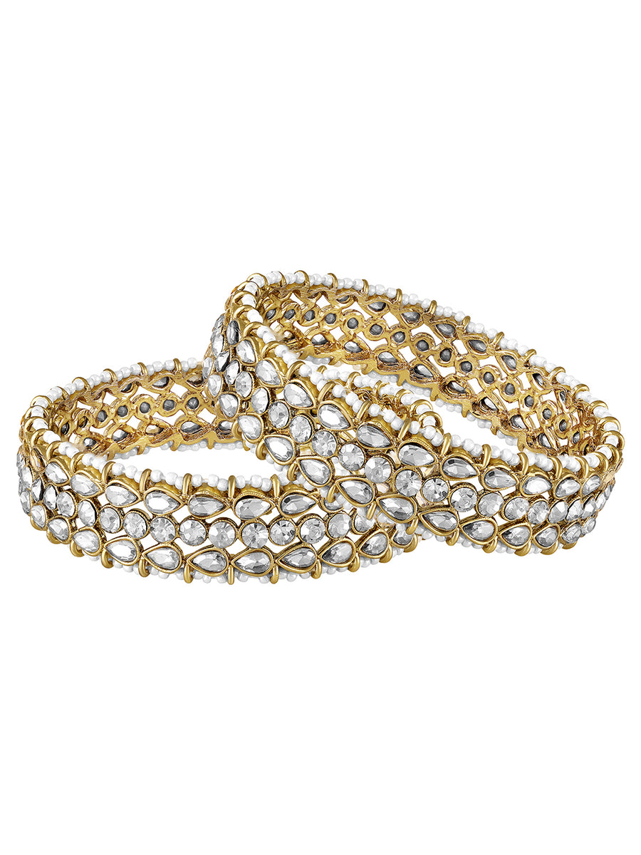Festive Finish Faux Kundan Pair. Pair of Bangles with white colour kundan stones along with pearls on the edge.