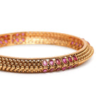 Royal Allure Charm Bangle Pair in Gold - Rani Pink featuring Faux Ruby  bangle set 
