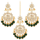 Majestic Glow Earring and Maangtikka. Pair of earrings & Maangtikka, with gold plating, kundan, green beads along with pearls. Buy best selling jewellery from Peora.