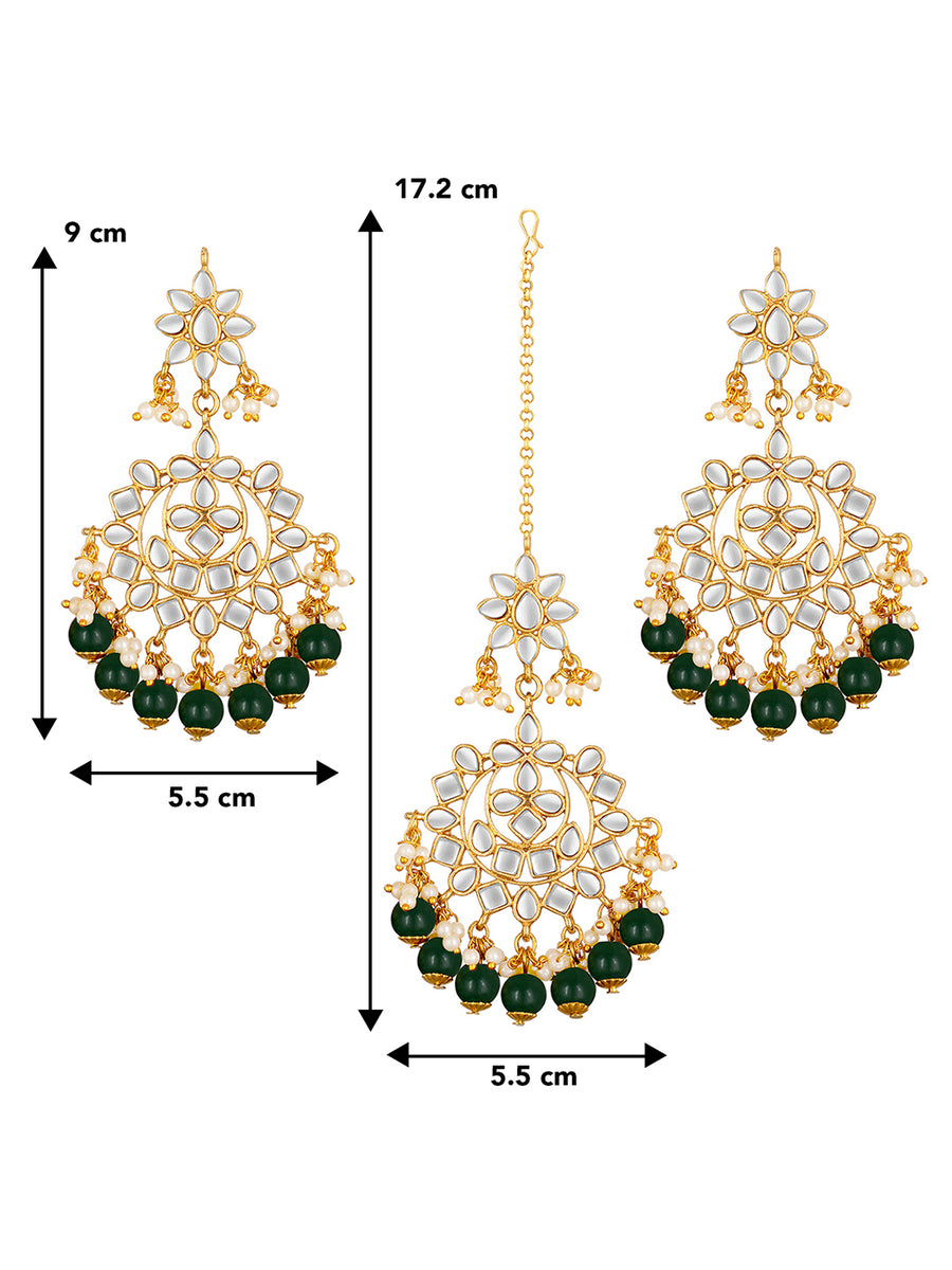 Majestic Glow Earring and Maangtikka. Pair of earrings & Maangtikka, with gold plating, kundan, green beads along with pearls. Buy best selling jewellery from Peora.