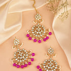 Majestic Glow Earring and Maangtikka. Pair of earrings & Maangtikka, with gold plating, kundan, pink beads along with pearls. Buy best selling jewellery from Peora.