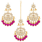 Majestic Glow Earring and Maangtikka. Pair of earrings & Maangtikka, with gold plating, kundan, pink beads along with pearls. Buy best selling jewellery from Peora.