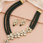 Floral Glow Ethnic Necklace Set. Black beaded necklace with gold and white Kundan floral motifs.