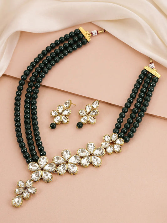 Floral Glow Ethnic Necklace Set. Black beaded necklace with gold and white Kundan floral motifs.