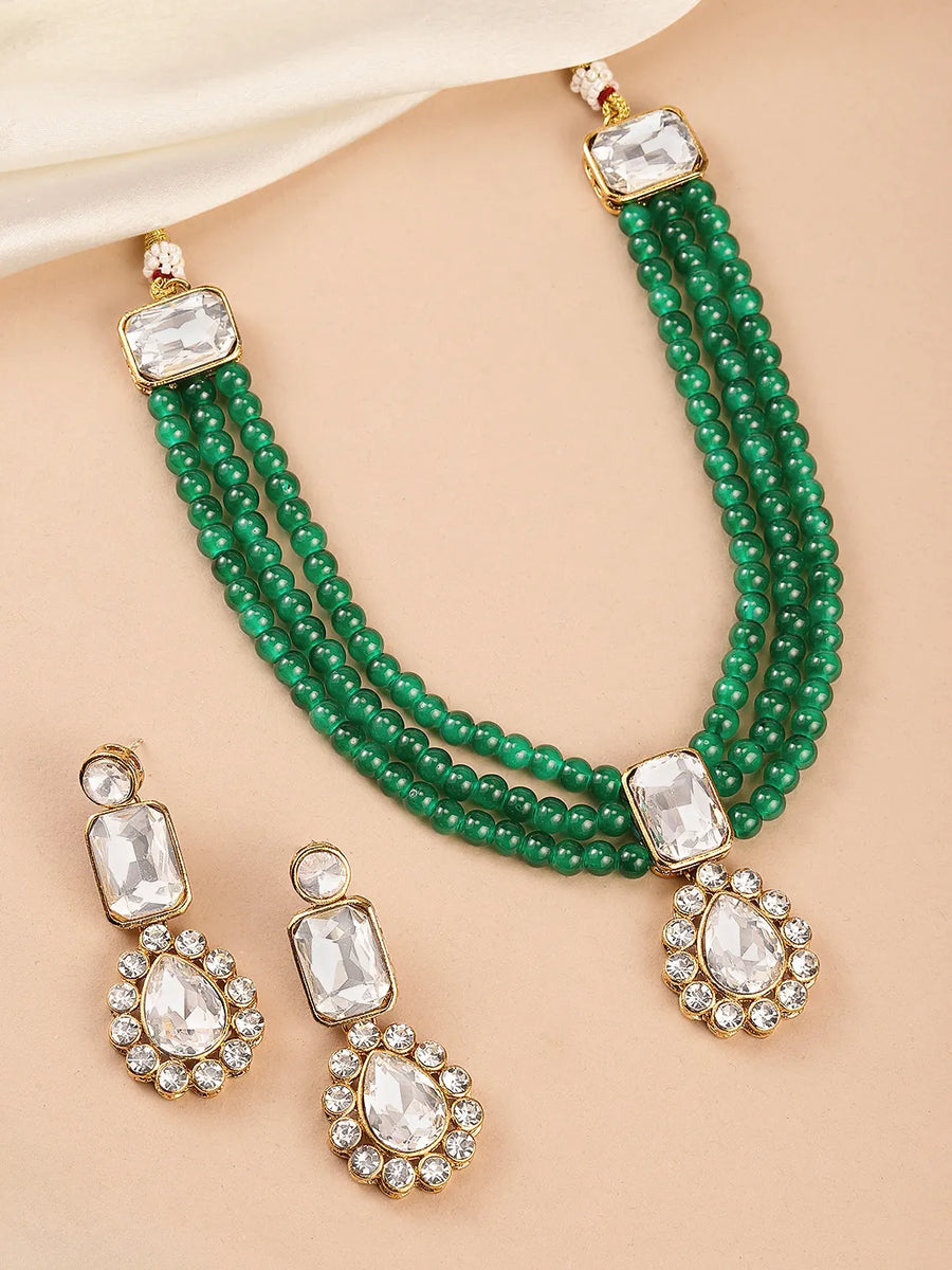 Evergreen Shine Green Necklace Set. Gold-plated green beaded necklace set with white stones and matching earrings.