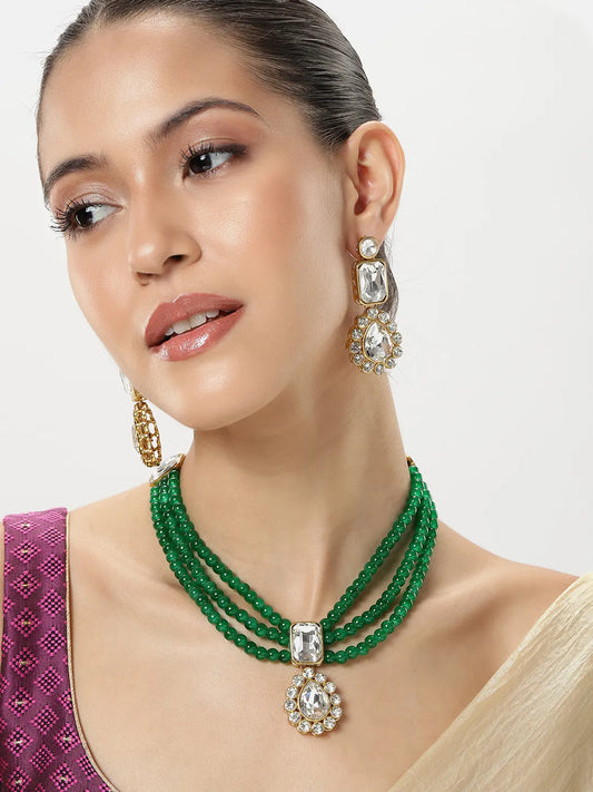 Evergreen Shine Green Necklace Set. Gold-plated green beaded necklace set with white stones and matching earrings.