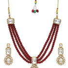 Graceful Layers with Kundan Set. Gold-plated red beaded necklace set with large white stones and matching drop earrings.