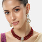 Graceful Layers with Kundan Set. Gold-plated red beaded necklace set with large white stones and matching drop earrings.