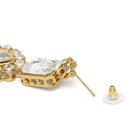 Graceful Layers with Kundan Set. Gold-plated red beaded necklace set with large white stones and matching drop earrings.