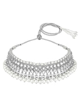 Bridal Splendour Kundan Pearls Set. Silver-plated layered bridal necklace set with pearls, kundan and matching earrings, complemented by a maang tikka.