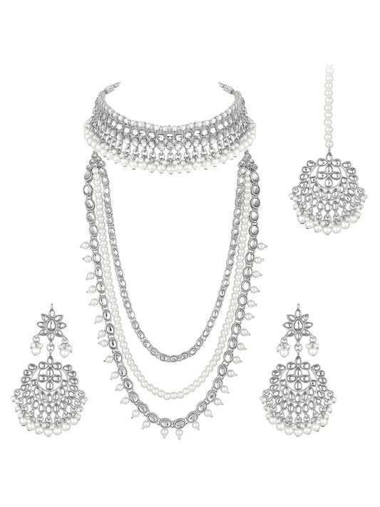 Bridal Splendour Kundan Pearls Set. Silver-plated layered bridal necklace set with pearls, kundan and matching earrings, complemented by a maang tikka.