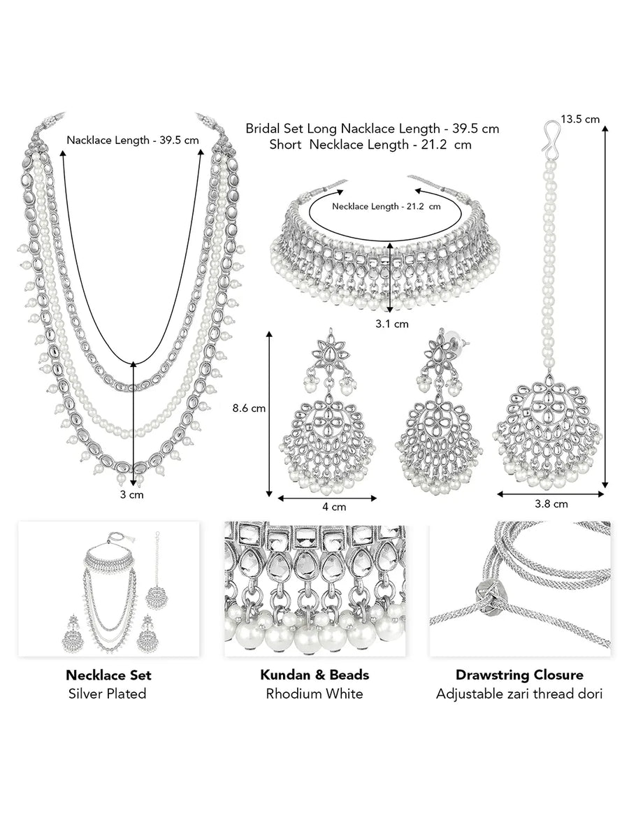 Bridal Splendour Kundan Pearls Set. Silver-plated layered bridal necklace set with pearls, kundan and matching earrings, complemented by a maang tikka.