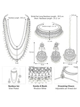 Bridal Splendour Kundan Pearls Set. Silver-plated layered bridal necklace set with pearls, kundan and matching earrings, complemented by a maang tikka.