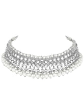 Bridal Splendour Kundan Pearls Set. Silver-plated layered bridal necklace set with pearls, kundan and matching earrings, complemented by a maang tikka.