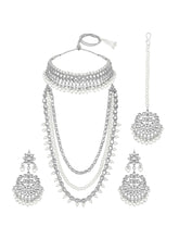 Bridal Splendour Kundan Pearls Set. Silver-plated layered bridal necklace set with pearls, kundan and matching earrings, complemented by a maang tikka.