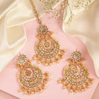 Radiance Kundan Pearl Maangtikka Set. Gold-plated chandbali-style earrings & Maangtikka with pearls and kundan.