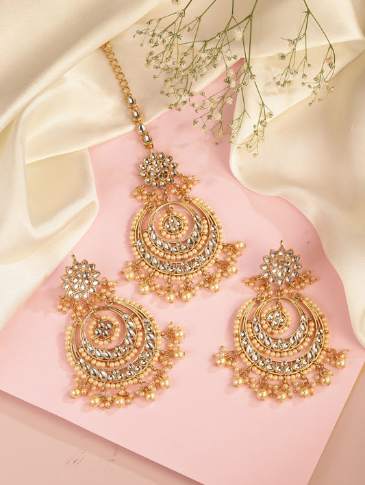 Radiance Kundan Pearl Maangtikka Set. Gold-plated chandbali-style earrings & Maangtikka with pearls and kundan.