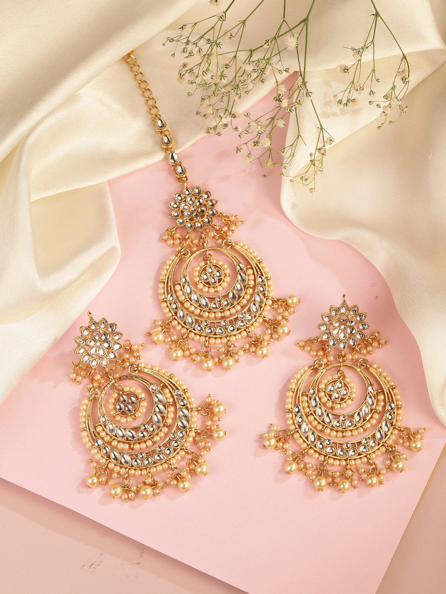 Radiance Kundan Pearl Maangtikka Set. Gold-plated chandbali-style earrings & Maangtikka with pearls and kundan.