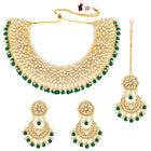 Divine Grace Kundan Bridal Set. Gold and green Kundan necklace set with pearls, matching earrings, and maang tikka.