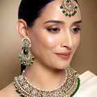 Divine Grace Kundan Bridal Set. Gold and green Kundan necklace set with pearls, matching earrings, and maang tikka.