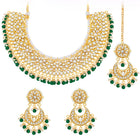 Divine Grace Kundan Bridal Set. Gold and green Kundan necklace set with pearls, matching earrings, and maang tikka.