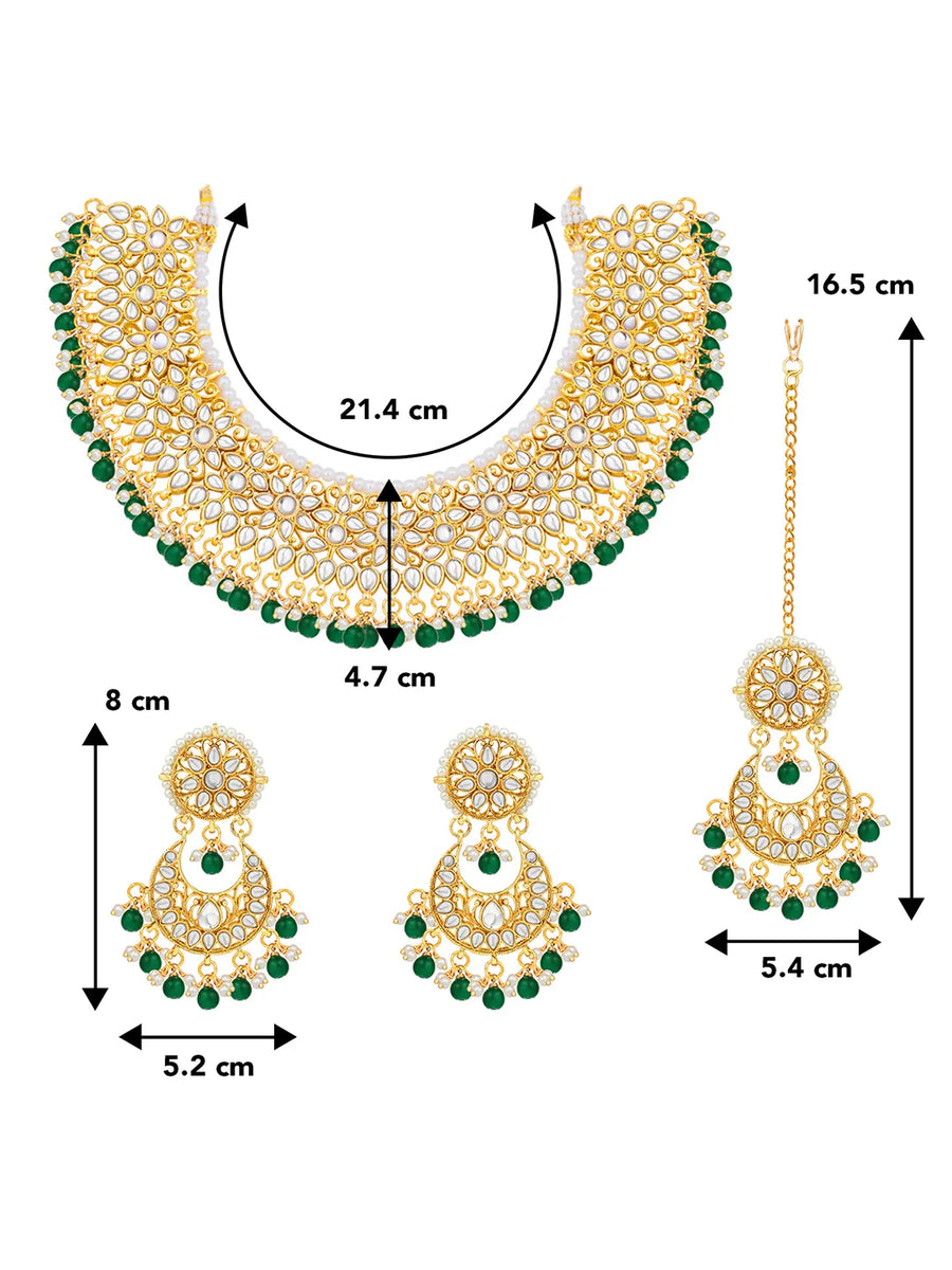 Divine Grace Kundan Bridal Set. Gold and green Kundan necklace set with pearls, matching earrings, and maang tikka.