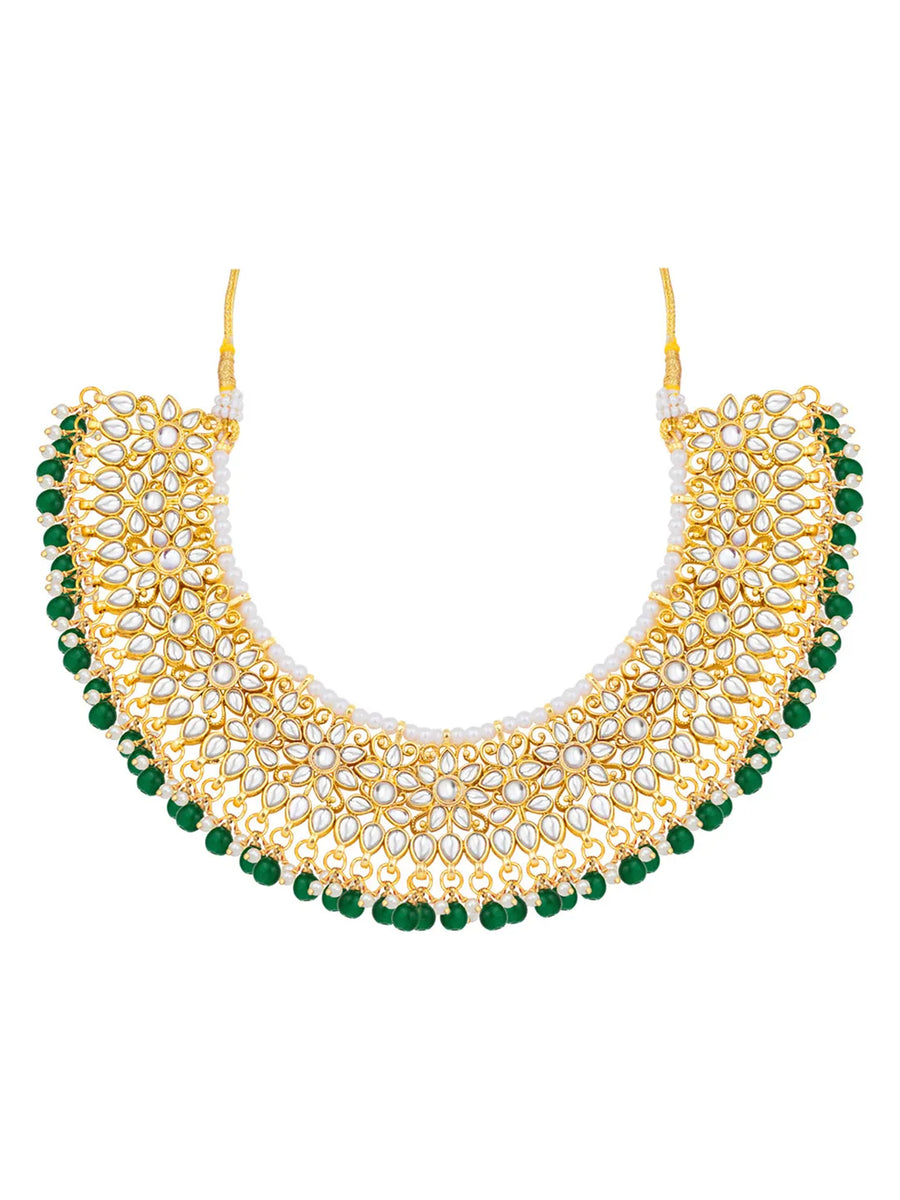 Divine Grace Kundan Bridal Set. Gold and green Kundan necklace set with pearls, matching earrings, and maang tikka.