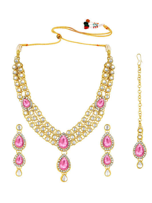 Majesty Kundan Long Necklace Set. Gold-plated Kundan necklace set with pink stones and kundan, paired with matching earrings and maang tikka.