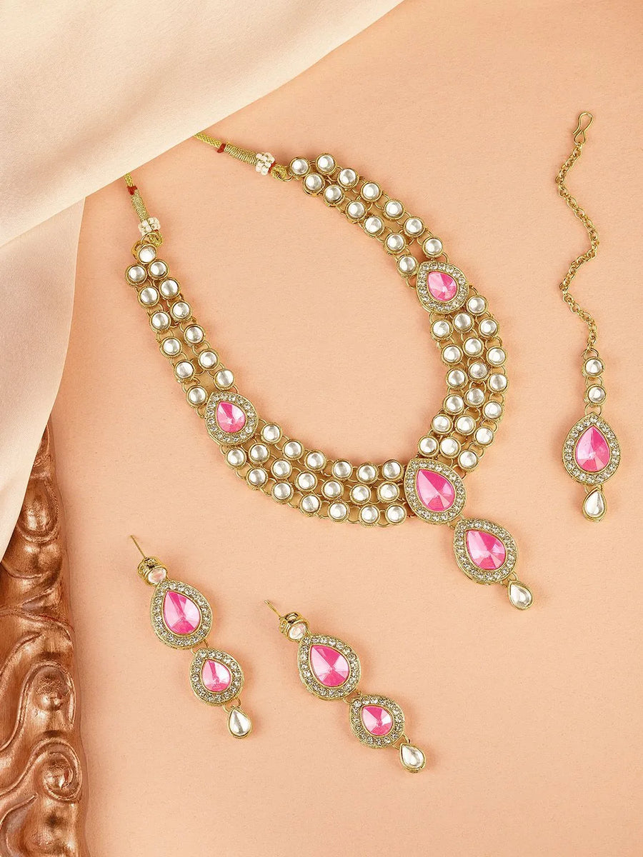 Majesty Kundan Long Necklace Set. Gold-plated Kundan necklace set with pink stones and kundan, paired with matching earrings and maang tikka.