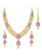 Majesty Kundan Long Necklace Set. Gold-plated Kundan necklace set with pink stones and kundan, paired with matching earrings and maang tikka.