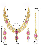 Majesty Kundan Long Necklace Set. Gold-plated Kundan necklace set with pink stones and kundan, paired with matching earrings and maang tikka.