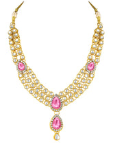 Majesty Kundan Long Necklace Set. Gold-plated Kundan necklace set with pink stones and kundan, paired with matching earrings and maang tikka.
