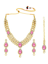 Majesty Kundan Long Necklace Set. Gold-plated Kundan necklace set with pink stones and kundan, paired with matching earrings and maang tikka.