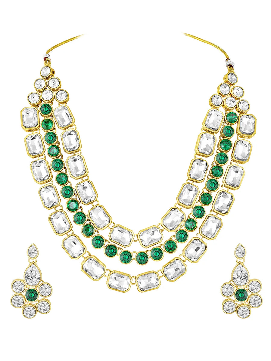 Crystal Studded Layered Necklace Set. Gold-plated Kundan necklace set with green and white stones, paired with matching earrings.