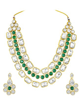Crystal Studded Layered Necklace Set. Gold-plated Kundan necklace set with green and white stones, paired with matching earrings.