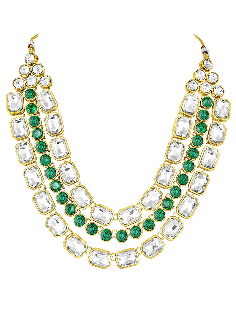 Crystal Studded Layered Necklace Set. Gold-plated Kundan necklace set with green and white stones, paired with matching earrings.