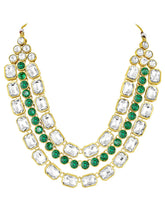 Crystal Studded Layered Necklace Set. Gold-plated Kundan necklace set with green and white stones, paired with matching earrings.