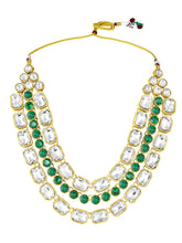 Crystal Studded Layered Necklace Set. Gold-plated Kundan necklace set with green and white stones, paired with matching earrings.