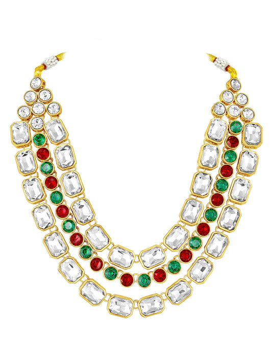 Crystal Studded Layered Necklace Set. Gold-plated Kundan necklace set with green, red and white stones, paired with matching earrings.