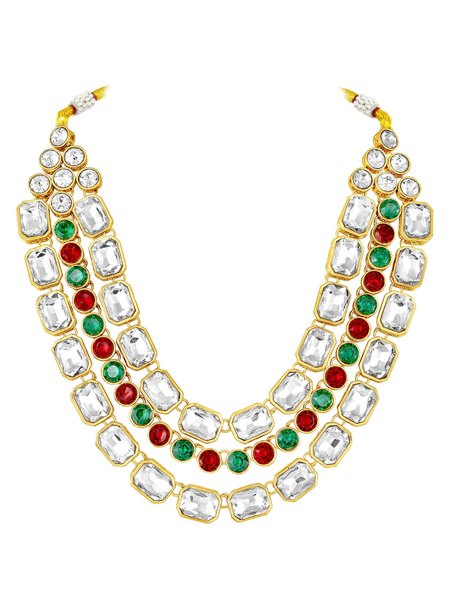 Crystal Studded Layered Necklace Set. Gold-plated Kundan necklace set with green, red and white stones, paired with matching earrings.