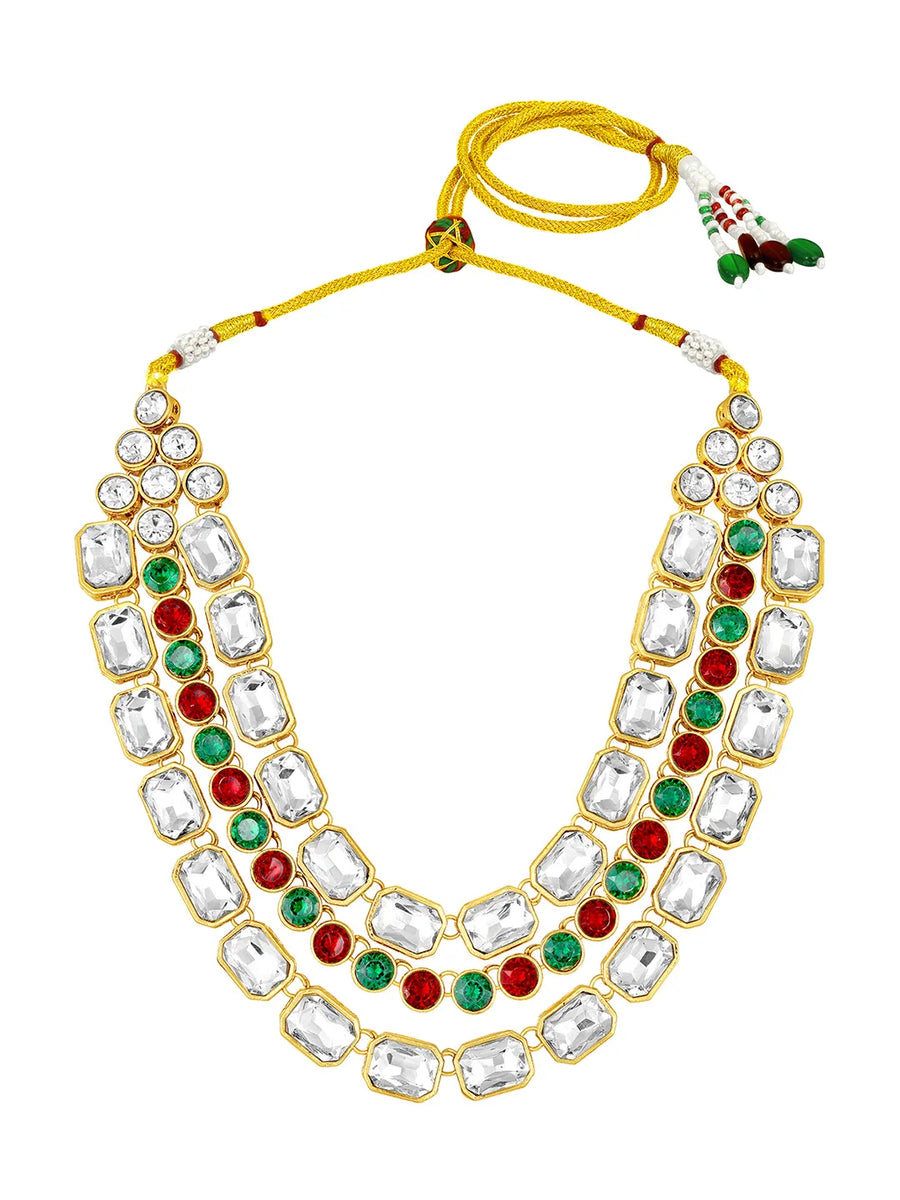 Crystal Studded Layered Necklace Set. Gold-plated Kundan necklace set with green, red and white stones, paired with matching earrings.