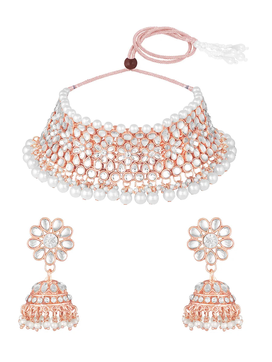 Radiance Faux Kundan Choker Set. Rose gold choker necklace set with white pearls and kundan, paired with matching floral jhumka earrings.